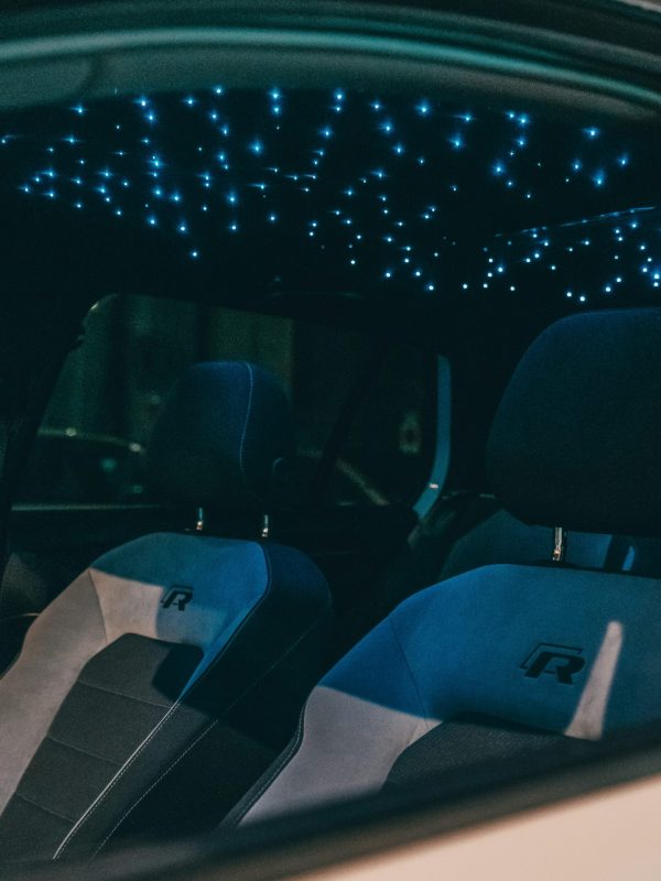 Custom starlight headliner glowing inside a vehicle cabin